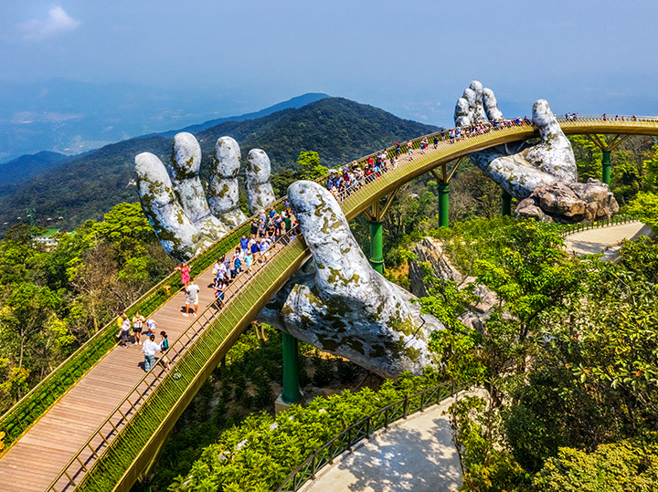 View of the Golden Bridge, which is lifted by two giant hands on Ba Na Hill in Da Nang, Vietnam